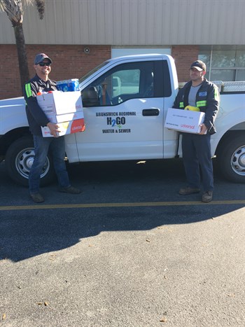 H2GO Employees Dropping off Boxes of Supplies